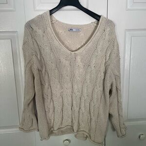 Wide neck cable knit sweater